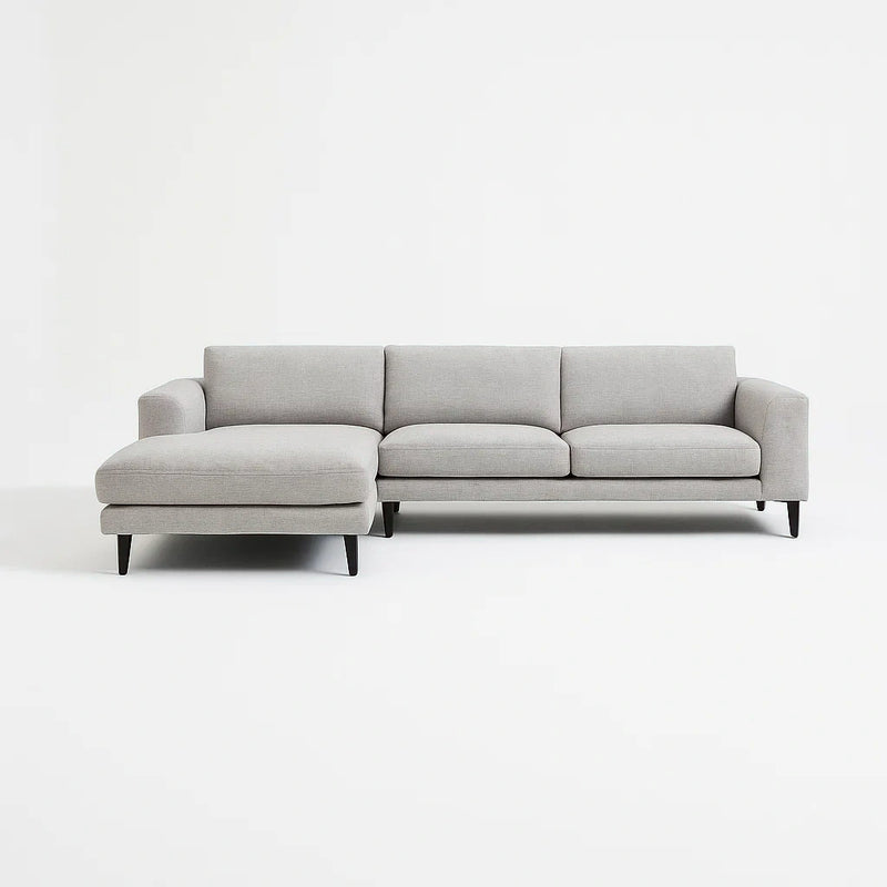 Divano angolare in tessuto grigio con chaise longue